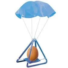 Blue straws put together to make a triangle with an egg sitting in the middle attached to a blue parachute.